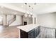 Eat-in kitchen with large island, dark cabinets, and open to living area at 14905 Tamarack Dr, Charlotte, NC 28278