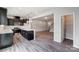 Modern kitchen with dark cabinetry, quartz countertops, and an island at 14905 Tamarack Dr, Charlotte, NC 28278