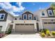Townhouse exterior with attached garage and landscaping at 14905 Tamarack Dr, Charlotte, NC 28278