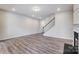 Spacious living room with hardwood floors and stairs at 14905 Tamarack Dr, Charlotte, NC 28278