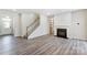 Spacious living room with hardwood floors and a fireplace at 14905 Tamarack Dr, Charlotte, NC 28278