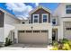 Townhouse exterior with attached garage and landscaping at 14905 Tamarack Dr, Charlotte, NC 28278