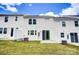 Townhouse with a private backyard, patio, and grassy area at 14905 Tamarack Dr, Charlotte, NC 28278