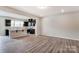 Open concept kitchen with island and dark cabinets at 14905 Tamarack Dr, Charlotte, NC 28278