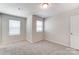 Spacious bedroom featuring neutral walls, carpet, and two windows at 14905 Tamarack Dr, Charlotte, NC 28278