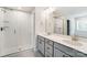 Double vanity bathroom with a large shower and modern fixtures at 14901 Tamarack Dr, Charlotte, NC 28278