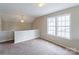 Bright loft area with windows and carpeting at 8614 Sawleaf Ct, Charlotte, NC 28215