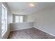 Bright loft bedroom with window and carpeting at 8614 Sawleaf Ct, Charlotte, NC 28215