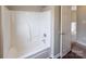 Bathroom with tub shower and an additional door at 8614 Sawleaf Ct, Charlotte, NC 28215