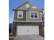 Two-story home with stone accents and a two-car garage at 3543 Nimbell Rd, Monroe, NC 28110