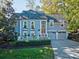 Two-story house with gray siding, red door, and two-car garage at 94 Heritage Dr, Lake Wylie, SC 29710