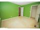 Bedroom with green walls and carpet flooring at 100 Christopher Ave, Mount Holly, NC 28120