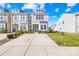 Two-story townhome with a driveway and front yard at 339 Halton Crossing Sw Dr, Concord, NC 28027