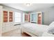 Bedroom with built-in shelving, window seat, and a desk at 7006 Garden Hill Dr, Huntersville, NC 28078
