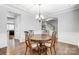 Elegant dining room with a charming wooden table and chandelier at 7006 Garden Hill Dr, Huntersville, NC 28078