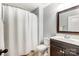 Clean bathroom with shower/tub combo, vanity, and mirror at 7006 Garden Hill Dr, Huntersville, NC 28078