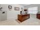 Home office with a desk, computer, and built-in shelving at 7006 Garden Hill Dr, Huntersville, NC 28078