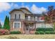 Two-story house with stone and siding exterior at 7006 Garden Hill Dr, Huntersville, NC 28078