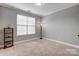 Bright bedroom with neutral walls and plush carpeting at 7006 Garden Hill Dr, Huntersville, NC 28078