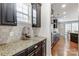 Well-equipped kitchen with granite countertops and dark wood cabinets at 7006 Garden Hill Dr, Huntersville, NC 28078