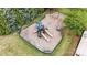 Aerial view of a playground with swings, slides, and picnic tables at 7006 Garden Hill Dr, Huntersville, NC 28078