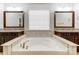 Primary bathroom with large soaking tub and double vanities at 7006 Garden Hill Dr, Huntersville, NC 28078