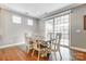 Bright dining room with hardwood floors and sliding glass doors at 7006 Garden Hill Dr, Huntersville, NC 28078