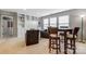Bonus room with built-in shelving, seating area, and a small table at 7006 Garden Hill Dr, Huntersville, NC 28078