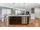 Large kitchen island with granite countertop and stainless steel dishwasher at 7006 Garden Hill Dr, Huntersville, NC 28078