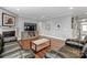 Spacious living room with hardwood floors and a cozy fireplace at 7006 Garden Hill Dr, Huntersville, NC 28078