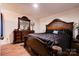Spacious bedroom with a large bed, dresser, and ample closet space at 831 College Ave, Shelby, NC 28152