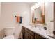 Bathroom with vanity, toilet, and decorative mirror at 831 College Ave, Shelby, NC 28152