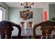 Elegant dining room with dark wood table and chairs, showcasing a stylish wall art piece at 831 College Ave, Shelby, NC 28152
