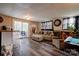 Spacious basement recreation room featuring a comfortable couch, ottoman, and pool table at 831 College Ave, Shelby, NC 28152