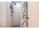 Clean shower with tile surround and pebble floor at 831 College Ave, Shelby, NC 28152