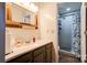 Updated bathroom with a walk-in shower, tile flooring, and a vanity at 831 College Ave, Shelby, NC 28152
