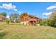 Two-story home with wood siding, deck, and large backyard at 831 College Ave, Shelby, NC 28152