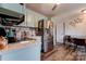 Modern kitchen with stainless steel appliances and light teal cabinets at 831 College Ave, Shelby, NC 28152