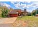 Two-story house with attached garage and stone chimney at 831 College Ave, Shelby, NC 28152