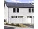 Rear view of townhome with white vinyl siding and private fenced yard at 1105 Kimball Landing Ln # 8, China Grove, NC 28023