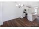 Bright dining room with hardwood floors and chandelier at 2208 Noble Townes Way, Charlotte, NC 28262