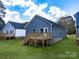 Back of house, featuring a deck and backyard at 606 Meadow Ave, Spencer, NC 28159