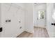 Laundry room with built-in shelving and exterior access at 606 Meadow St, Spencer, NC 28159