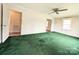 Large living room with green carpet and ceiling fan at 829 Cherry S Rd, Rock Hill, SC 29732