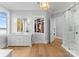 Luxurious bathroom with marble vanity, walk-in shower, and large closet at 16500 Green Dolphin Ln, Cornelius, NC 28031