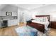 Elegant bedroom with dark wood furniture and a cozy rug at 16500 Green Dolphin Ln, Cornelius, NC 28031