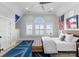 Spacious bedroom with lake views, a king-size bed, and Union Jack rug at 16500 Green Dolphin Ln, Cornelius, NC 28031