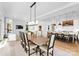 Bright dining area with large wood table and view into the kitchen at 16500 Green Dolphin Ln, Cornelius, NC 28031