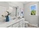 Bright bathroom with quartz countertop, updated vanity, and a window at 4367 Reed Creek Dr, Sherrills Ford, NC 28673