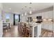 Modern kitchen with white cabinets, island, and stainless steel appliances at 4371 Reed Creek Dr, Sherrills Ford, NC 28673